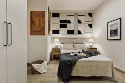 a bedroom with a bed with a wooden tray on it at Chixoy - 3 bedrooms and balcony in Eixample Dreta in Barcelona