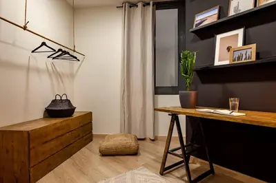 a dining room with a table and a chair at Hegra - 2 bedrooms, balcony in Eixample Esquerra in Barcelona