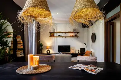 a potted plant on a wooden table in a hallway at Hegra - 2 bedrooms, balcony in Eixample Esquerra in Barcelona