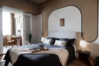 a bedroom with a large bed with a large mirror at Bara - 2 bedrooms in Eixample Dreta in Barcelona