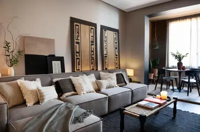 a living room with a couch and a table at Bara - 2 bedrooms in Eixample Dreta in Barcelona