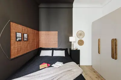 a bedroom with a large blue bed with two lamps at Anefis - 3 bedrooms and office in Gràcia in Barcelona