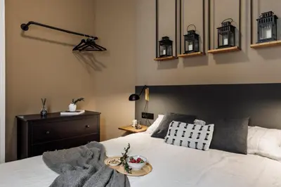 a bedroom with a bed with books on it at Anefis - 3 bedrooms and office in Gràcia in Barcelona