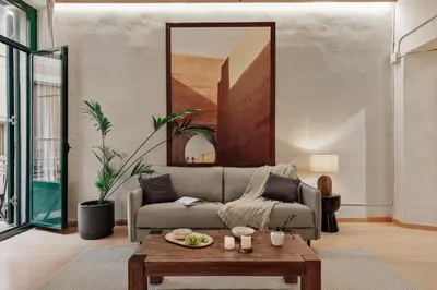 a living room with a couch and a table at Thar - 1 bedroom in Ciutat Vella in Barcelona