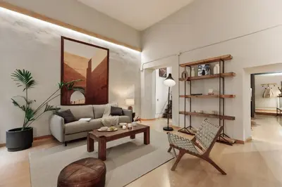 a kitchen with a island in a room with stairs at Thar - 1 bedroom in Ciutat Vella in Barcelona