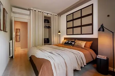 a living room with a couch and a table at Rissani - 2 bedrooms in Sant Gervasi in Barcelona