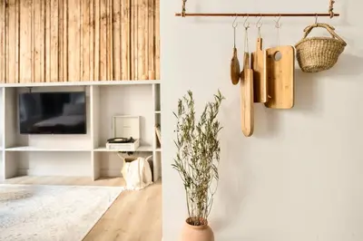 a bedroom with a large bed with a wooden headboard at Ebro - 3 bedrooms in Gràcia in Barcelona