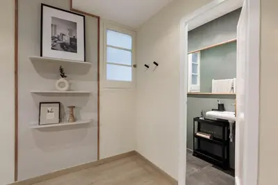 a bedroom with a bed with a book on it at Izabal - 3 bedrooms and office in Eixample Esquerra in Barcelona