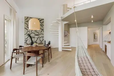 a hammock in a dining room with a table and chairs at Mille - 2 bedrooms and terrace in Poblenou in Barcelona