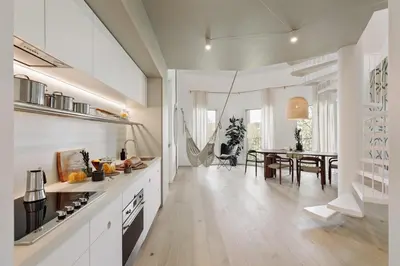 a room with a desk and a staircase in a room at Mille - 2 bedrooms and terrace in Poblenou in Barcelona