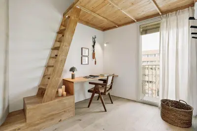 a patio with a table and chairs on a balcony at Mille - 2 bedrooms and terrace in Poblenou in Barcelona