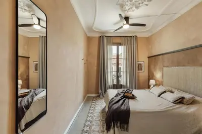 a kitchen with a stove with pots and pans on it at Erfoud - 3 bedrooms in Gràcia in Barcelona