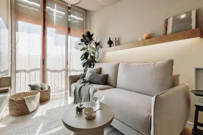 a dining room with a table and a mirror at Canadell - 2 bedrooms in Sant Antoni in Barcelona
