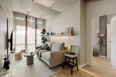 a kitchen with a wooden dining table and chairs at Canadell - 2 bedrooms in Sant Antoni in Barcelona