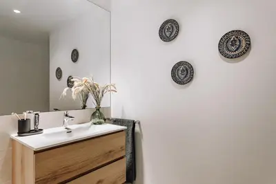 a shower with a glass door in a bathroom at Alhamilla - 1 bedroom in Eixample Dreta in Barcelona