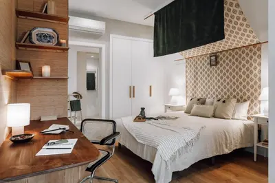 a dining room with a wooden table and chairs at Alhamilla - 1 bedroom in Eixample Dreta in Barcelona