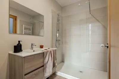a bedroom with a bed and a desk with a desk at Walla - 3 bedrooms and balcony in Eixample Dreta in Barcelona
