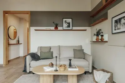a living room with a couch and a tv at Walla - 3 bedrooms and balcony in Eixample Dreta in Barcelona