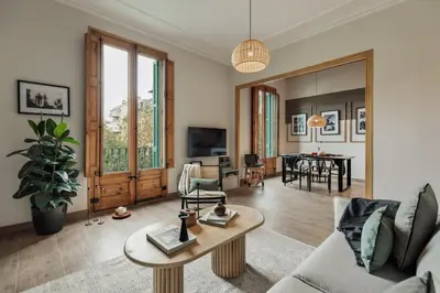 a bedroom with a desk with a bed and a chair at Walla - 3 bedrooms and balcony in Eixample Dreta in Barcelona