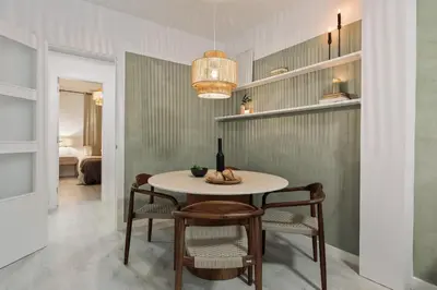 a bedroom with a bed and a table and a lamp at Drago - 3 bedrooms and balcony in Les Corts in Barcelona