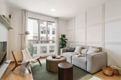 a living room with a couch and a chair at Gragnano - 2 bedrooms in Poblenou in Barcelona