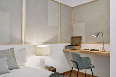 a white kitchen with white cabinets and a sink at Gragnano - 2 bedrooms in Poblenou in Barcelona