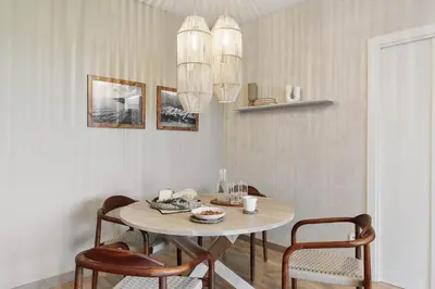 a living room with a table and chairs and a couch at Gragnano - 2 bedrooms in Poblenou in Barcelona