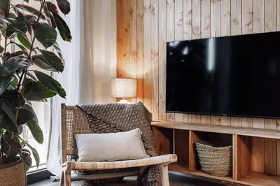 a room with a wooden wall with baskets on it at Zubia - 2 bedrooms in Eixample Esquerra in Barcelona
