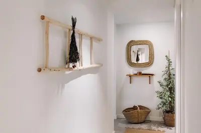 a hallway with white walls and a mirror at Zubia - 2 bedrooms in Eixample Esquerra in Barcelona