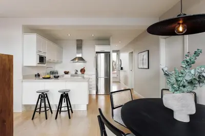 a patio with chairs and a table on a roof at Tossa - 2 bedroom and terrace in Eixample Esquerra in Barcelona