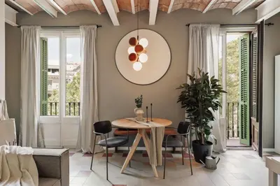 a bedroom with a bed with a book on it at Uyuni - 2 bedrooms and balcony in Eixample Dreta in Barcelona