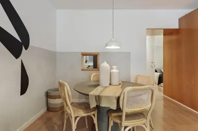 a living room with a table and a couch at Medes - 2 bedrooms in Sant Gervasi in Barcelona
