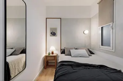 a living room with a couch and a table at Medes - 2 bedrooms in Sant Gervasi in Barcelona