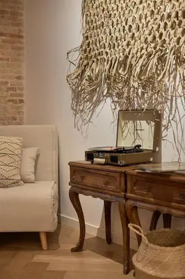 a kitchen with a counter and a brick wall at Zuma - 1 bedroom and terrace in Eixample Esquerra in Barcelona