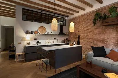 a dining room with a table and chairs at Zuma - 1 bedroom and terrace in Eixample Esquerra in Barcelona