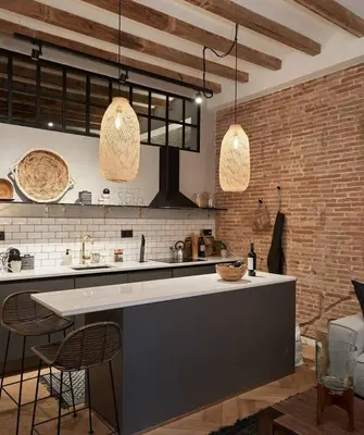 a living room with a table with a laptop on it at Zuma - 1 bedroom and terrace in Eixample Esquerra in Barcelona