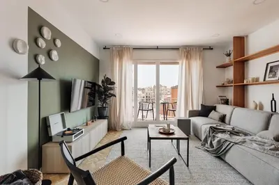 a room with a table and a mirror on the wall at Itza - 3 bedrooms and office and terrace in Gràcia in Barcelona