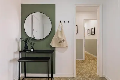 a hallway with a mirror and a table at Itza - 3 bedrooms and office and terrace in Gràcia in Barcelona
