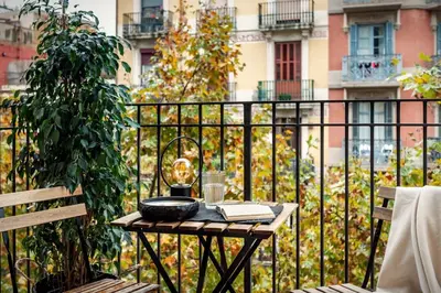 a bedroom with a large white bed and a window at Tokashi - 2 bedrooms and balcony in Eixample Dreta in Barcelona