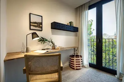 a home office with a desk and a balcony at Tokashi - 2 bedrooms and balcony in Eixample Dreta in Barcelona
