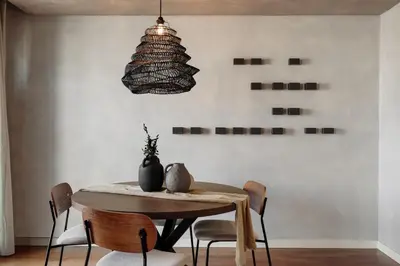 a kitchen with white cabinets and a stainless steel refrigerator at Emporda - 2 bedrooms in Eixample Esquerra in Barcelona