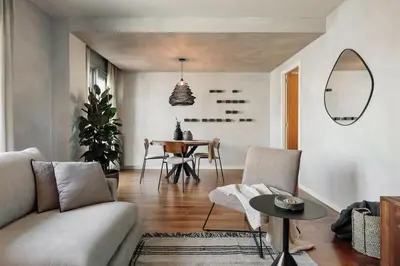 a hallway with a mirror next to a door at Emporda - 2 bedrooms in Eixample Esquerra in Barcelona