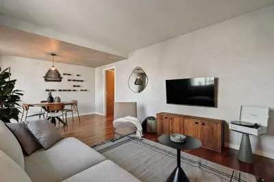a bedroom with a bed with a magazine on it at Emporda - 2 bedrooms in Eixample Esquerra in Barcelona