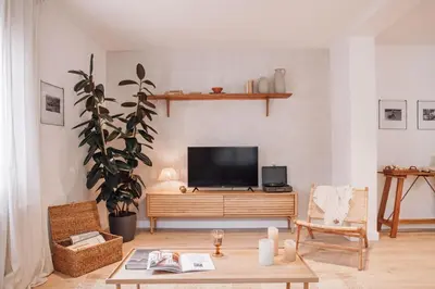 a kitchen with a table and chairs in a room at Casares - 1 bedroom in Gràcia in Barcelona