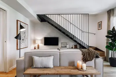 a bedroom with a bed and a large window at Campro - 3 bedrooms w/ balcony in Eixample Esquerra in Barcelona