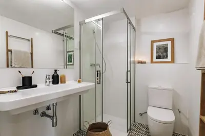a living room with a couch and a table at Campro - 3 bedrooms w/ balcony in Eixample Esquerra in Barcelona
