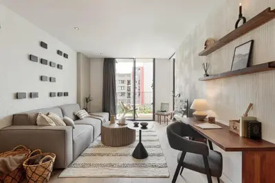 a bedroom with a large bed and a balcony at Lys - 2 bedrooms and pool in Eixample Esquerra in Barcelona