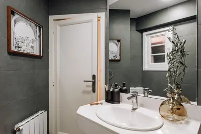 a bathroom with a sink and a mirror at Castellar - 2 bedrooms in Eixample Dreta in Barcelona