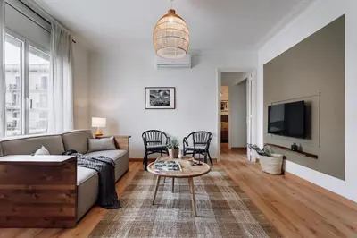 a dining room with a table and chairs at Castellar - 2 bedrooms in Eixample Dreta in Barcelona