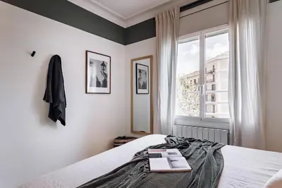 a living room with a couch and a table at Castellar - 2 bedrooms in Eixample Dreta in Barcelona